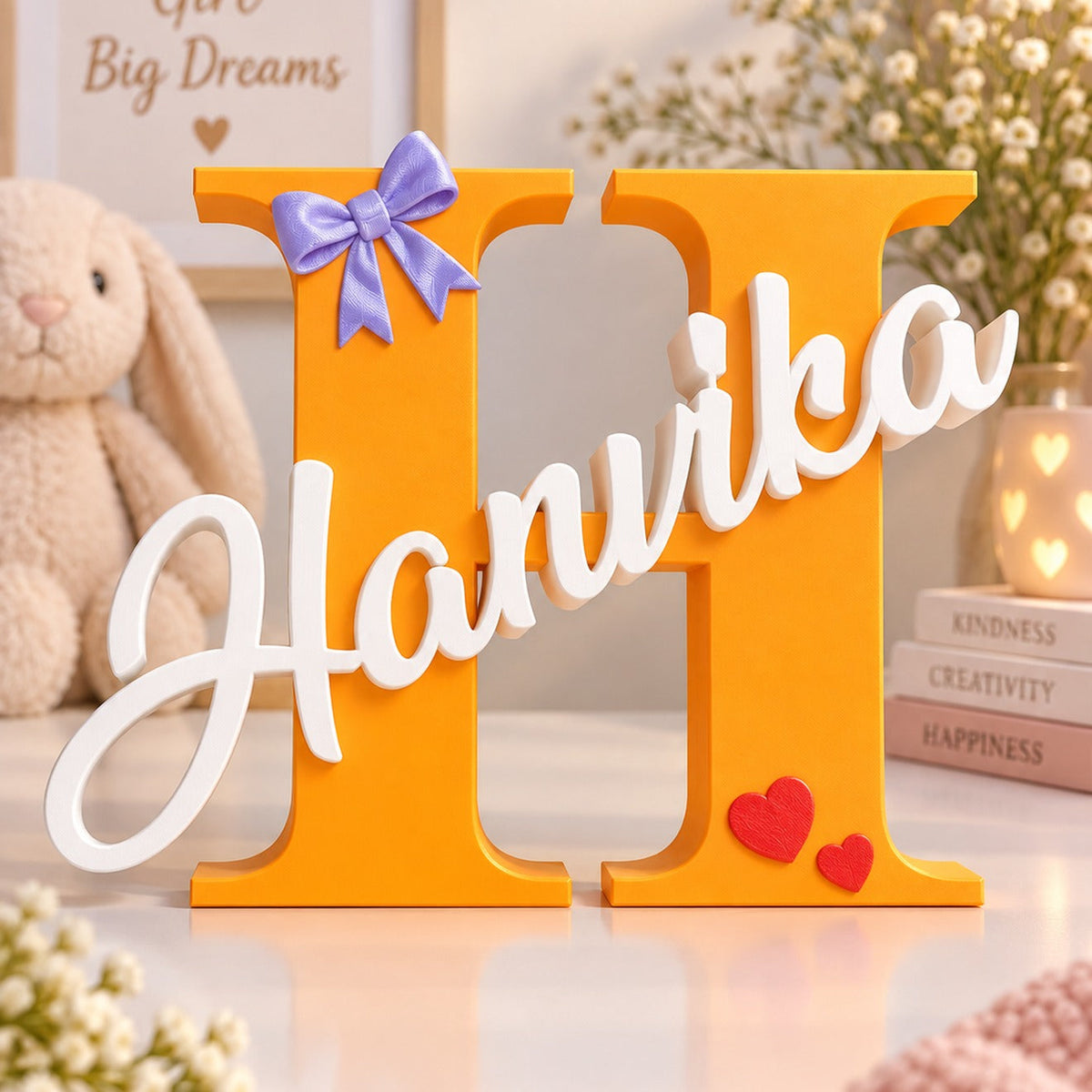 Personalized 3D printed big letter name sign — orange letter H with white script name Hanvika, purple bow and red hearts