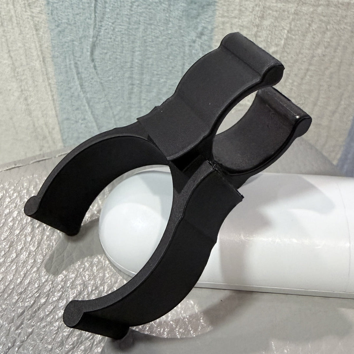 Pair of black 3D-printed backdrop stand rod holder clips