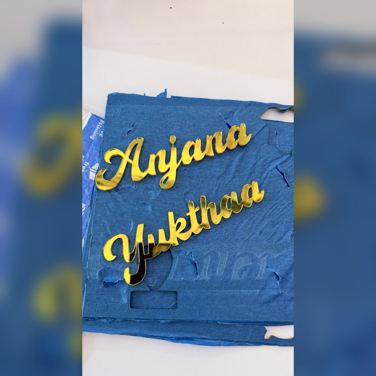 Gold mirror acrylic name cutouts in production