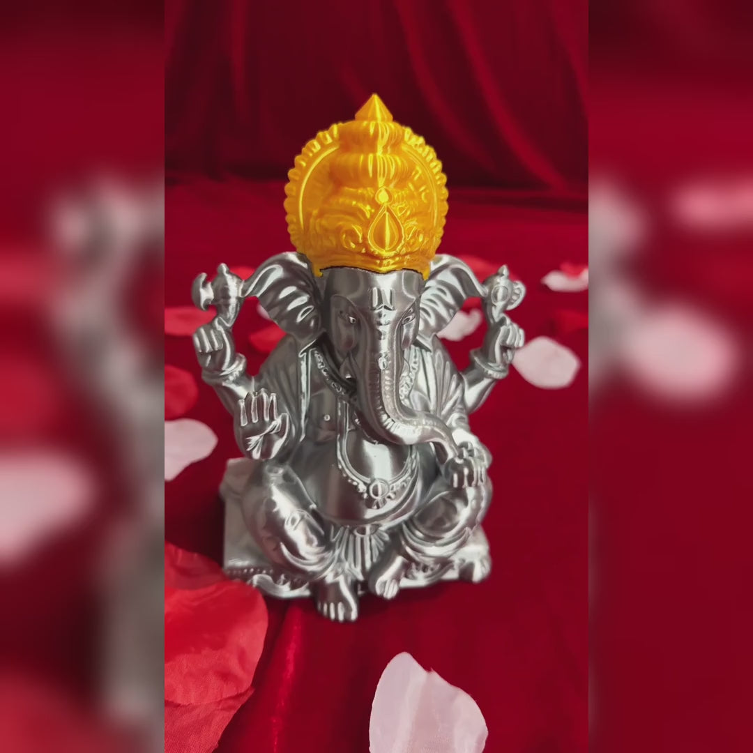 Product video: 3D-printed Ganesh Ji idol in metallic silver with gold crown, showcase on red fabric with petals