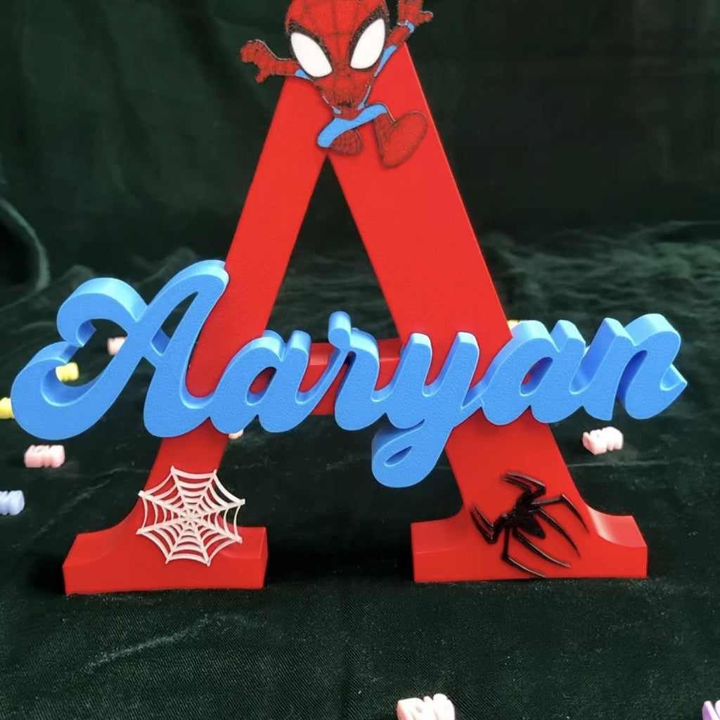 Close-up of spider-inspired 3D name sign with web details, kids room decor